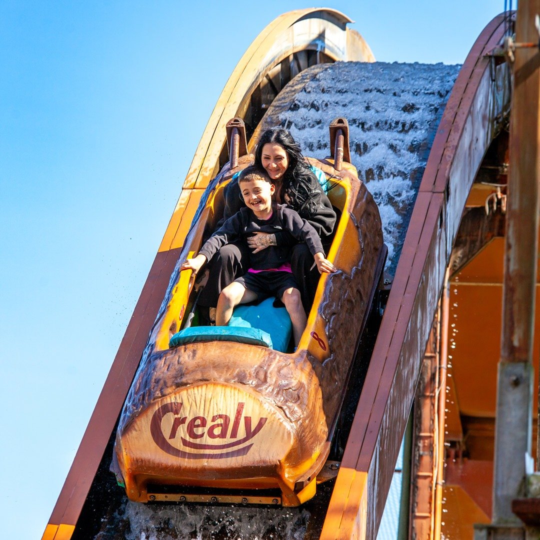 Families enjoying the rides at Crealy Theme Park and Resort near Exeter in Devon